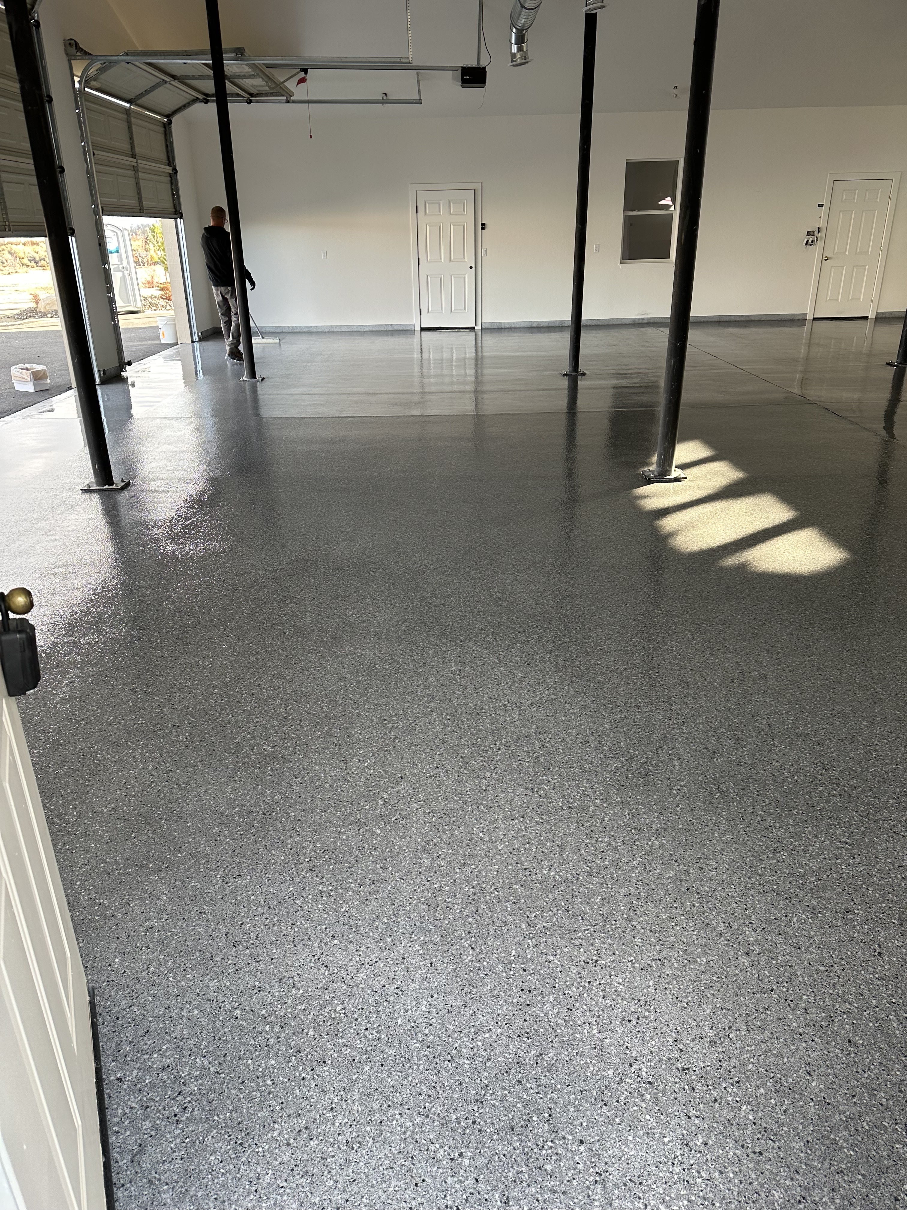 Polyaspartic-topcoat residential garage floor